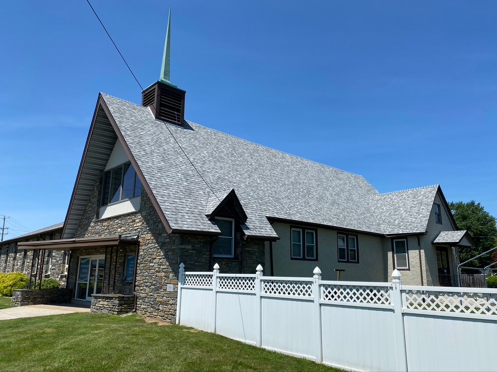 Wide campus overview of completed Crossway Community Church roof replacement