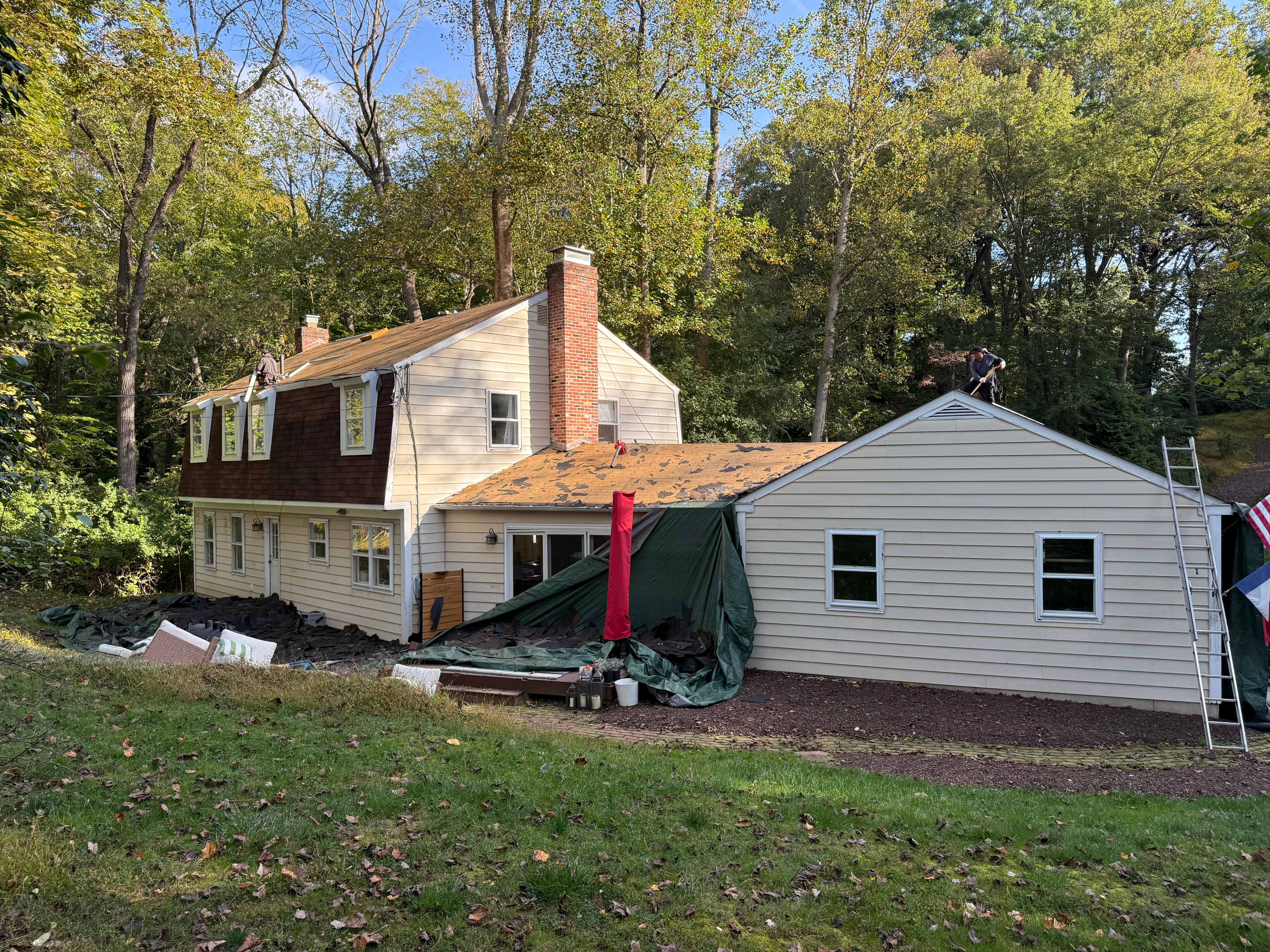 Rear elevation of Newtown Square home with original brown asphalt shingles before replacement