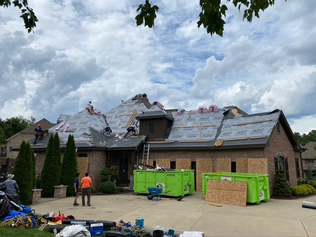 ABC underlayment being installed across multi-gable roofline