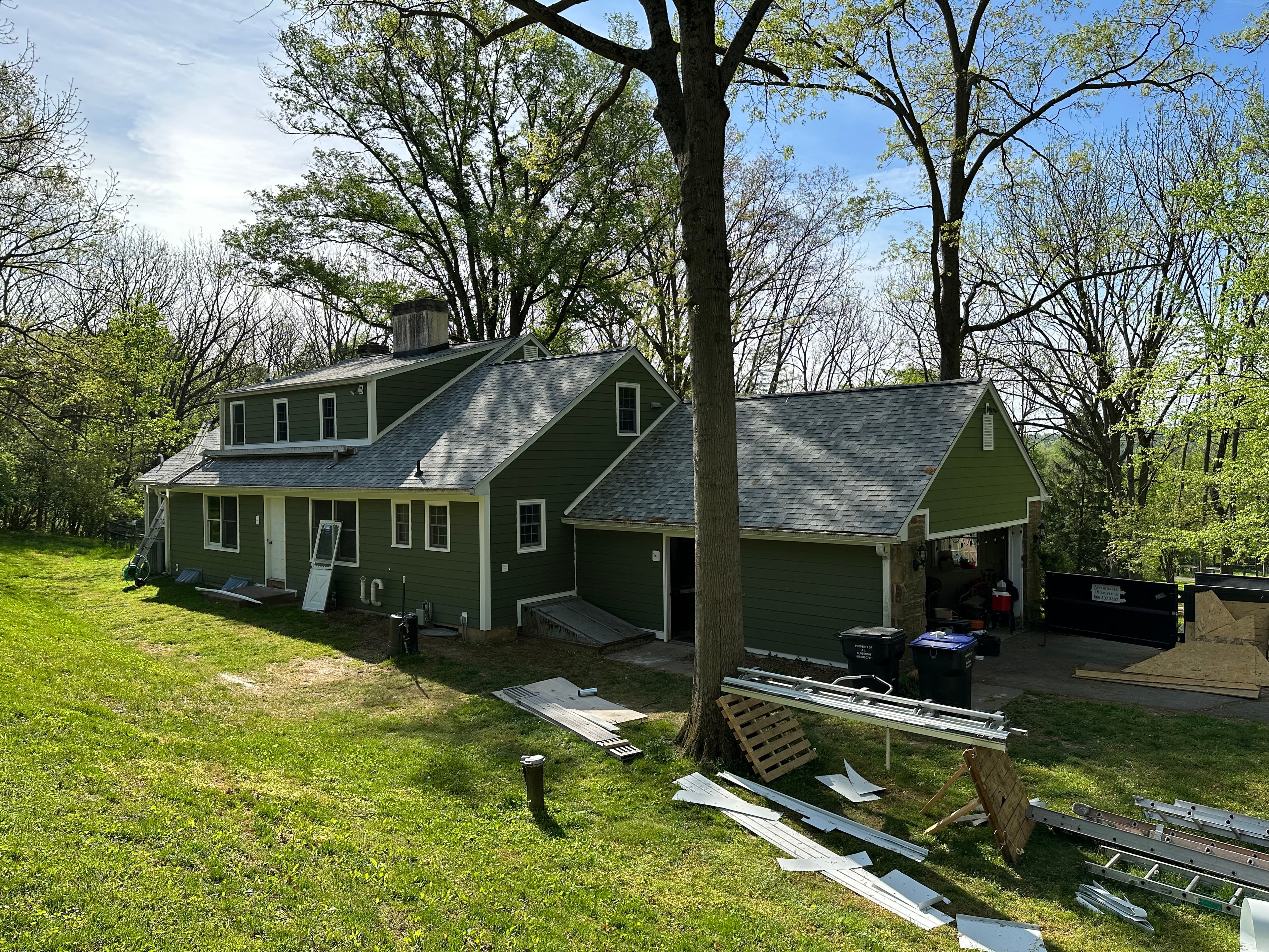 Completed rear of West Chester home with Mountain Sage James Hardie siding and Owens Corning Sierra Grey shingles