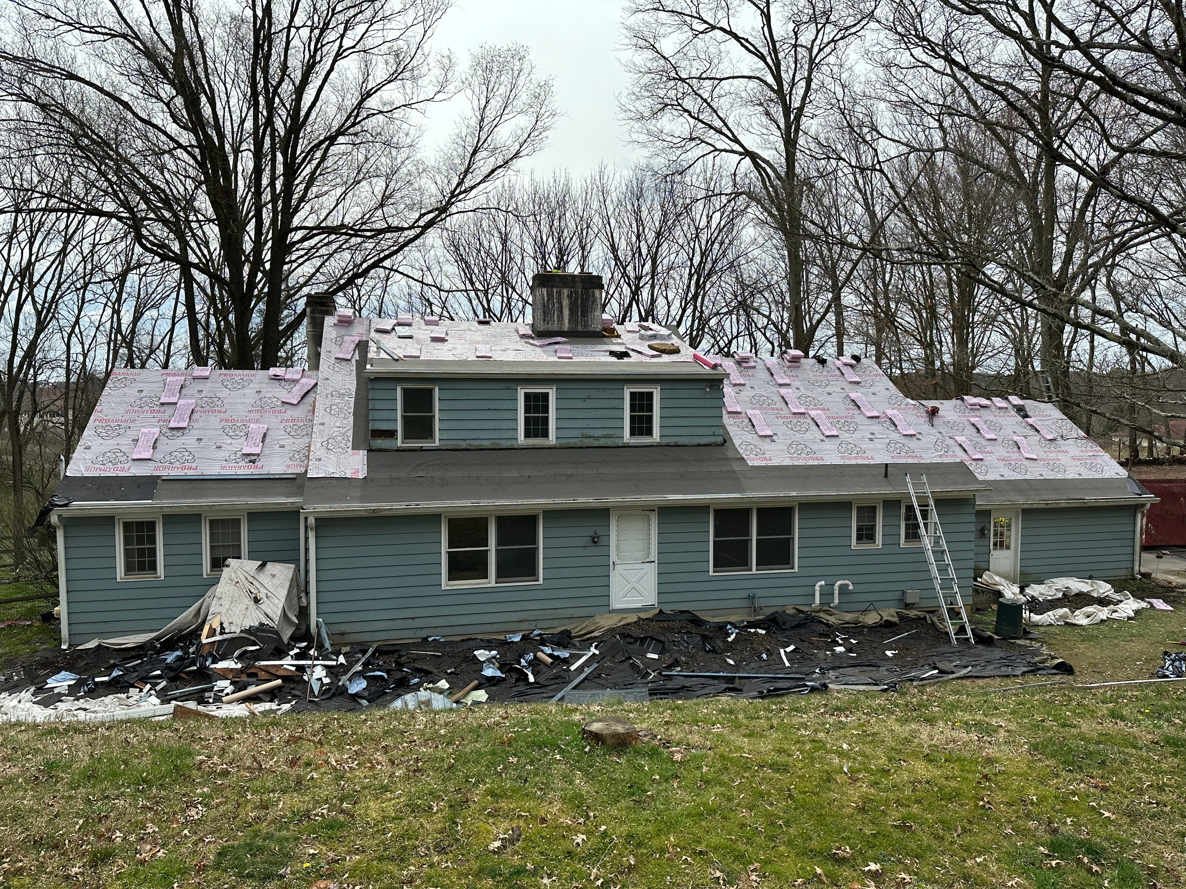 West Chester home with new Sierra Grey shingles complete and HydroGap house wrap being installed for siding